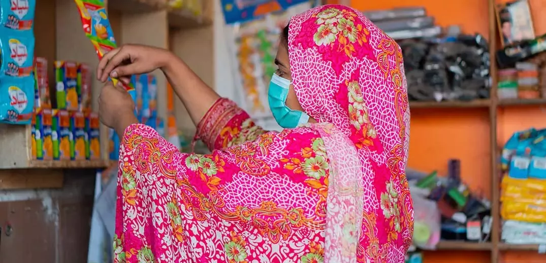 Woman looking at products in Pakistan