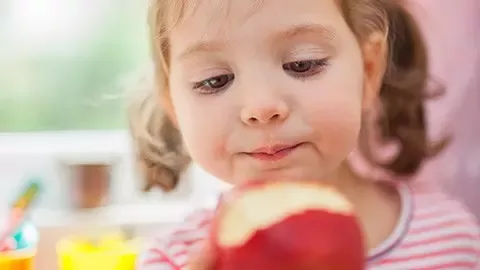 girl eating an apple